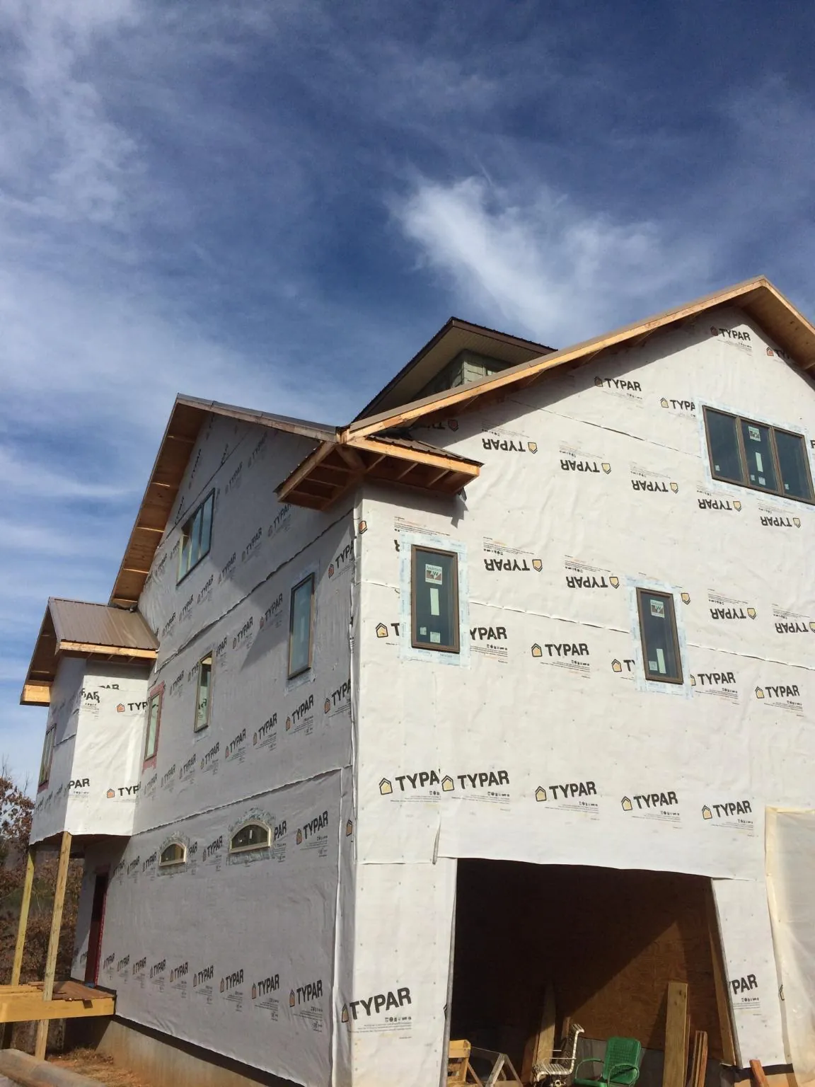 Stick built house wrapped in Typar with new roof framing and dormers in Starbuck